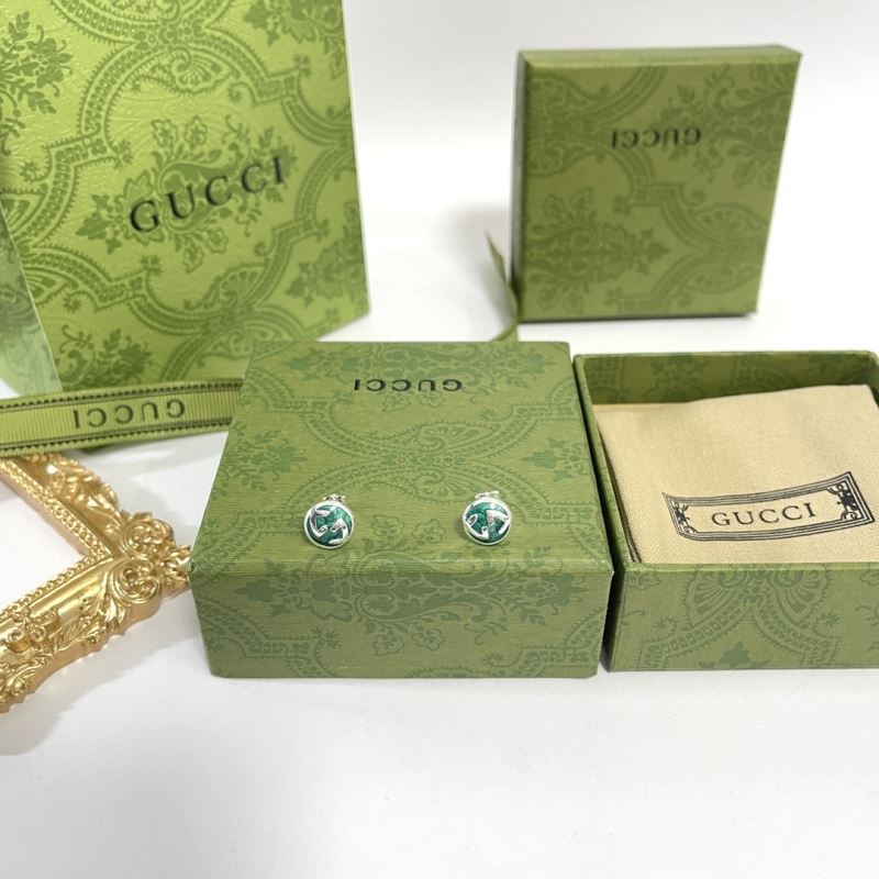 G*u*i earrings